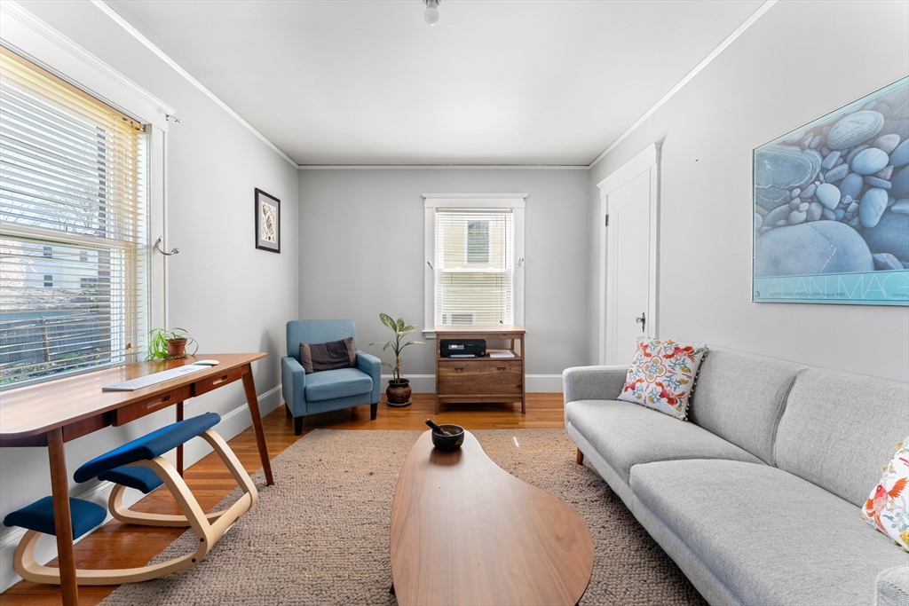 136 Beech Street Boston, MA 02131 - Photo 27 of 40 a living room with furniture and a window