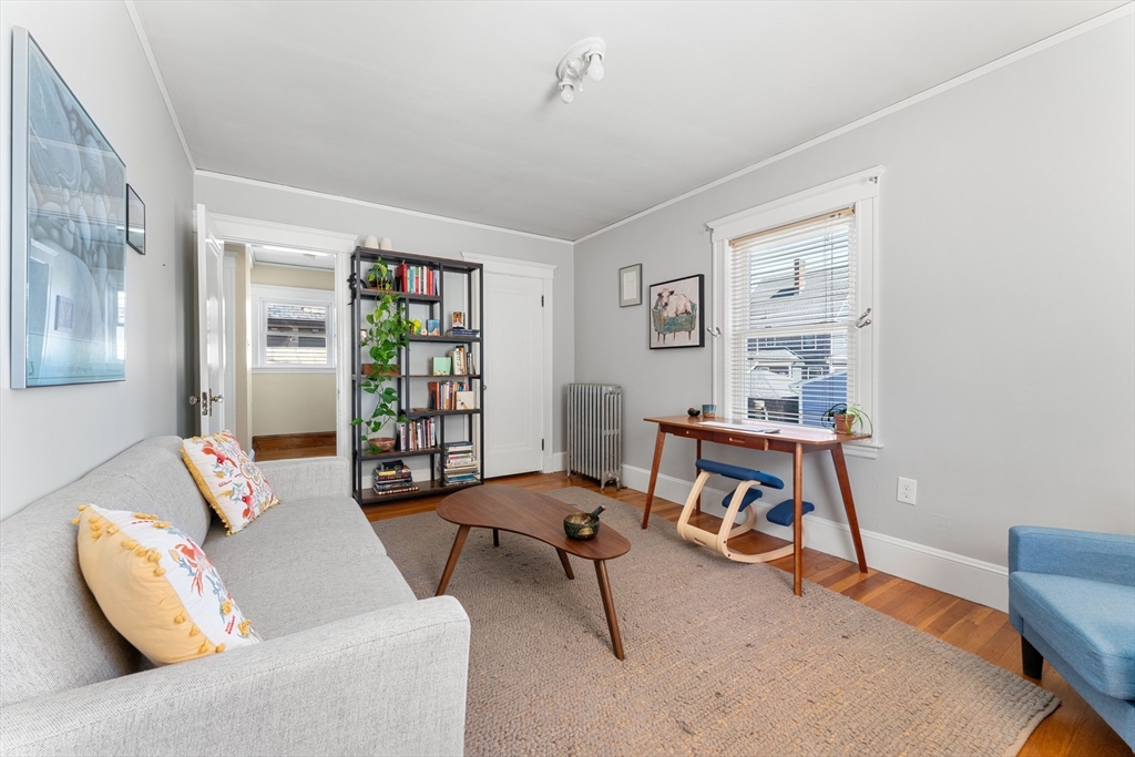 136 Beech Street Boston, MA 02131 - Photo 28 of 40 a living room with furniture and a window
