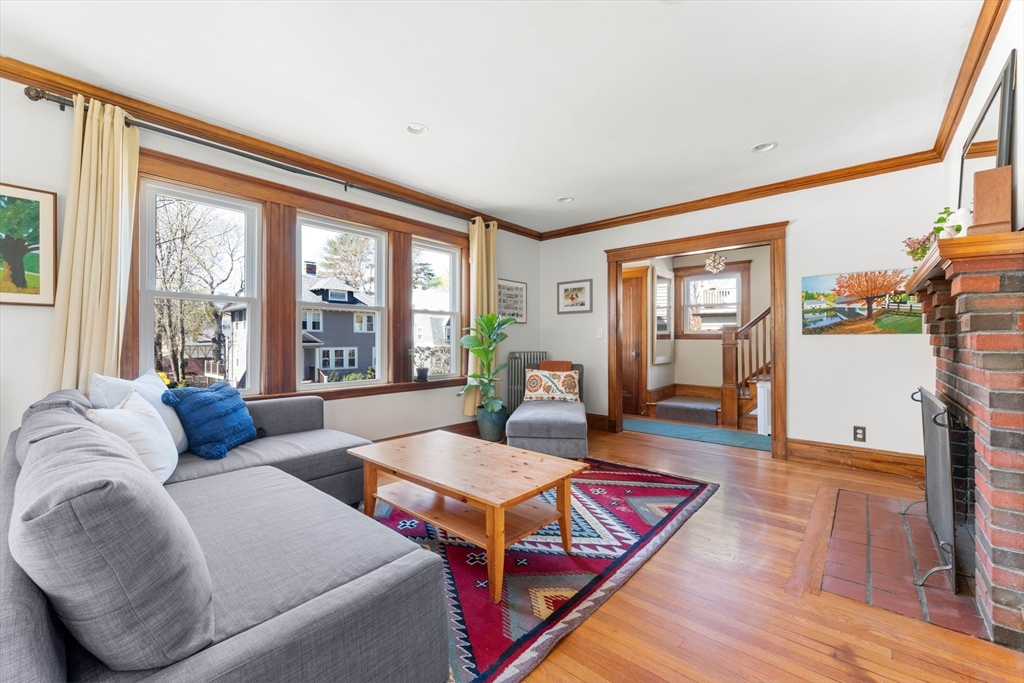 136 Beech Street Boston, MA 02131 - Photo 3 of 40 a living room with furniture and a large window