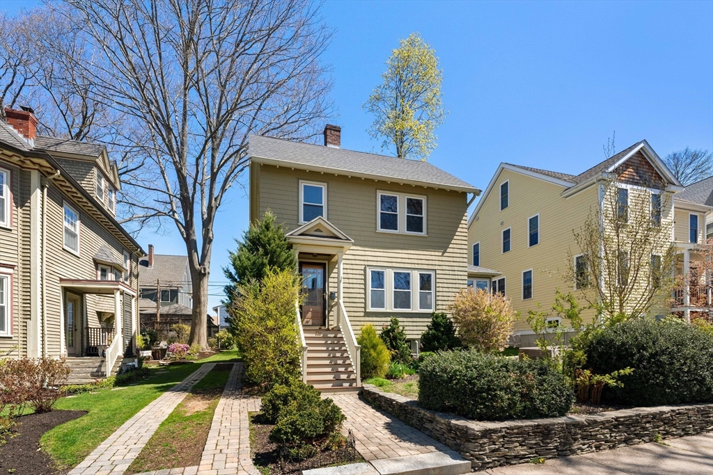 136 Beech Street Boston, MA 02131 - Photo 35 of 40 a front view of a house with a yard