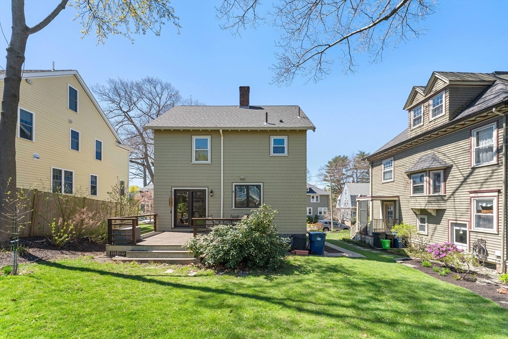 136 Beech Street Boston, MA 02131 - Photo 36 of 40 a view of a house with a yard