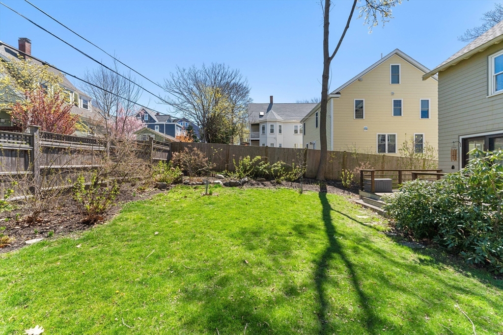 136 Beech Street Boston, MA 02131 - Photo 38 of 40 a view of backyard of house with green space