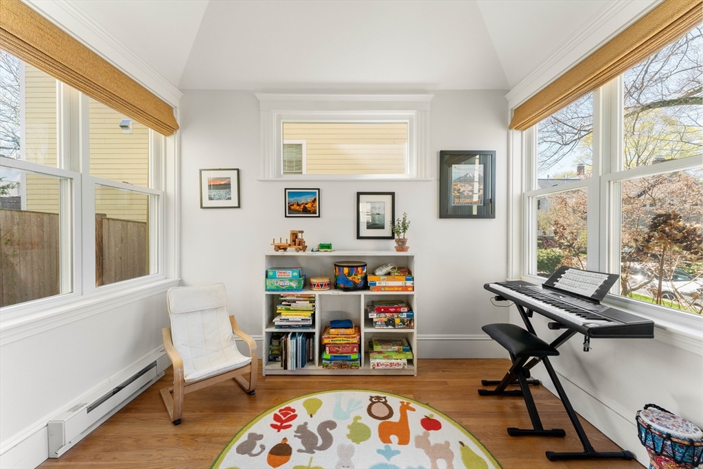 136 Beech Street Boston, MA 02131 - Photo 5 of 40 a reading room with furniture and a window