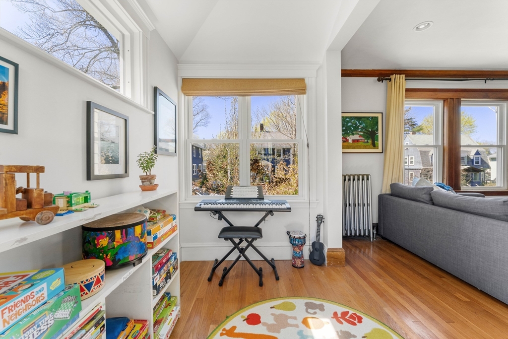 136 Beech Street Boston, MA 02131 - Photo 6 of 40 a living room with furniture and a large window