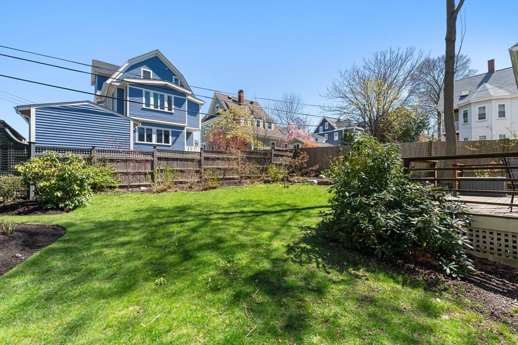 136 Beech Street Boston, MA 02131 - Photo 10 of 40 a front view of a house with garden