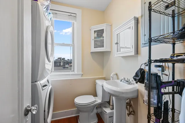 a bathroom with a sink toilet and mirror