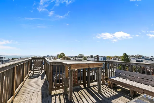 a view of a balcony with wooden floor