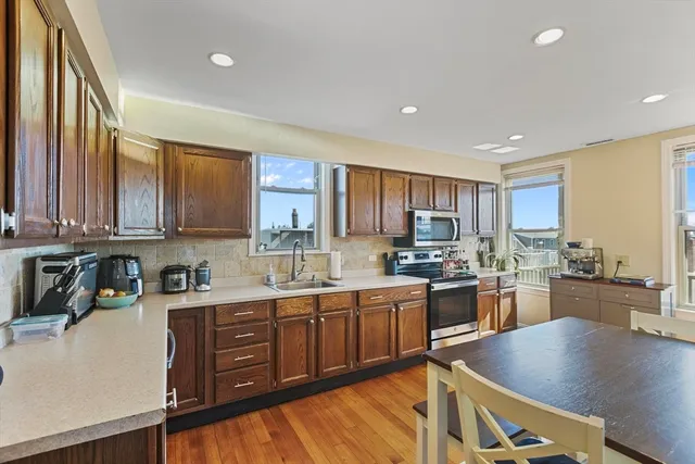 a kitchen with lots of counter top space and appliances