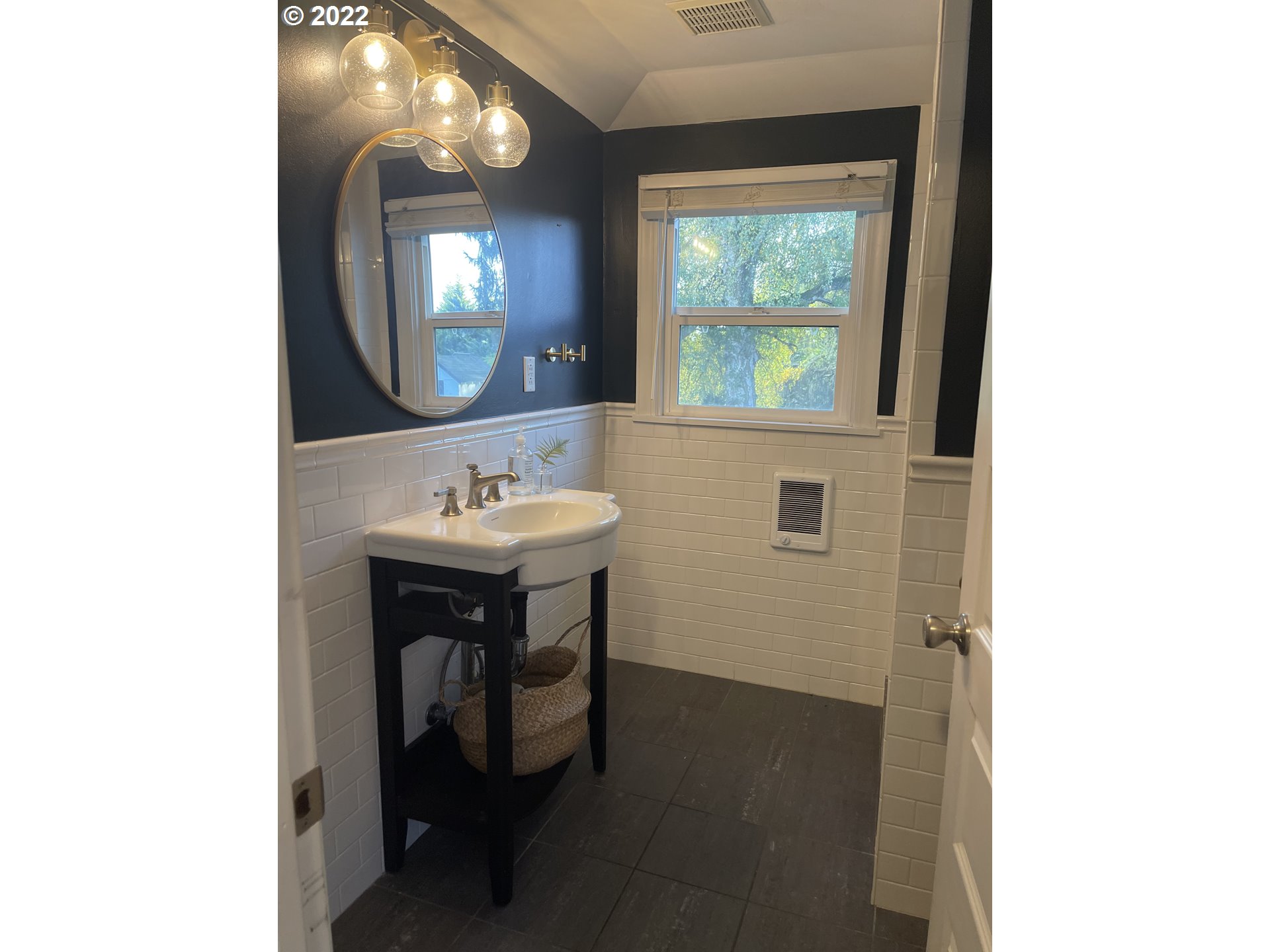 6214 Northwest 179th Street Ridgefield, WA 98642 - Photo 12 of 32 a bathroom with a sink and a mirror