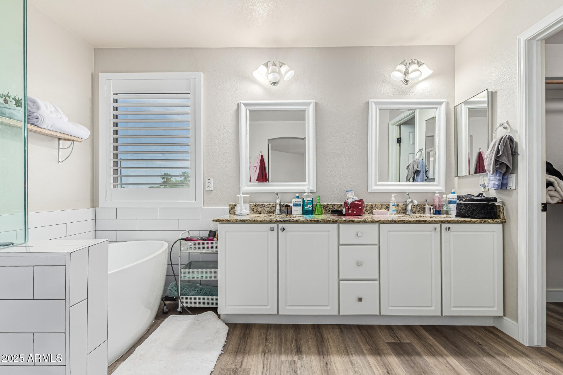 1038 East Harrison Court Gilbert, AZ 85295 - Photo 15 of 27 a bathroom with a sink and a mirror