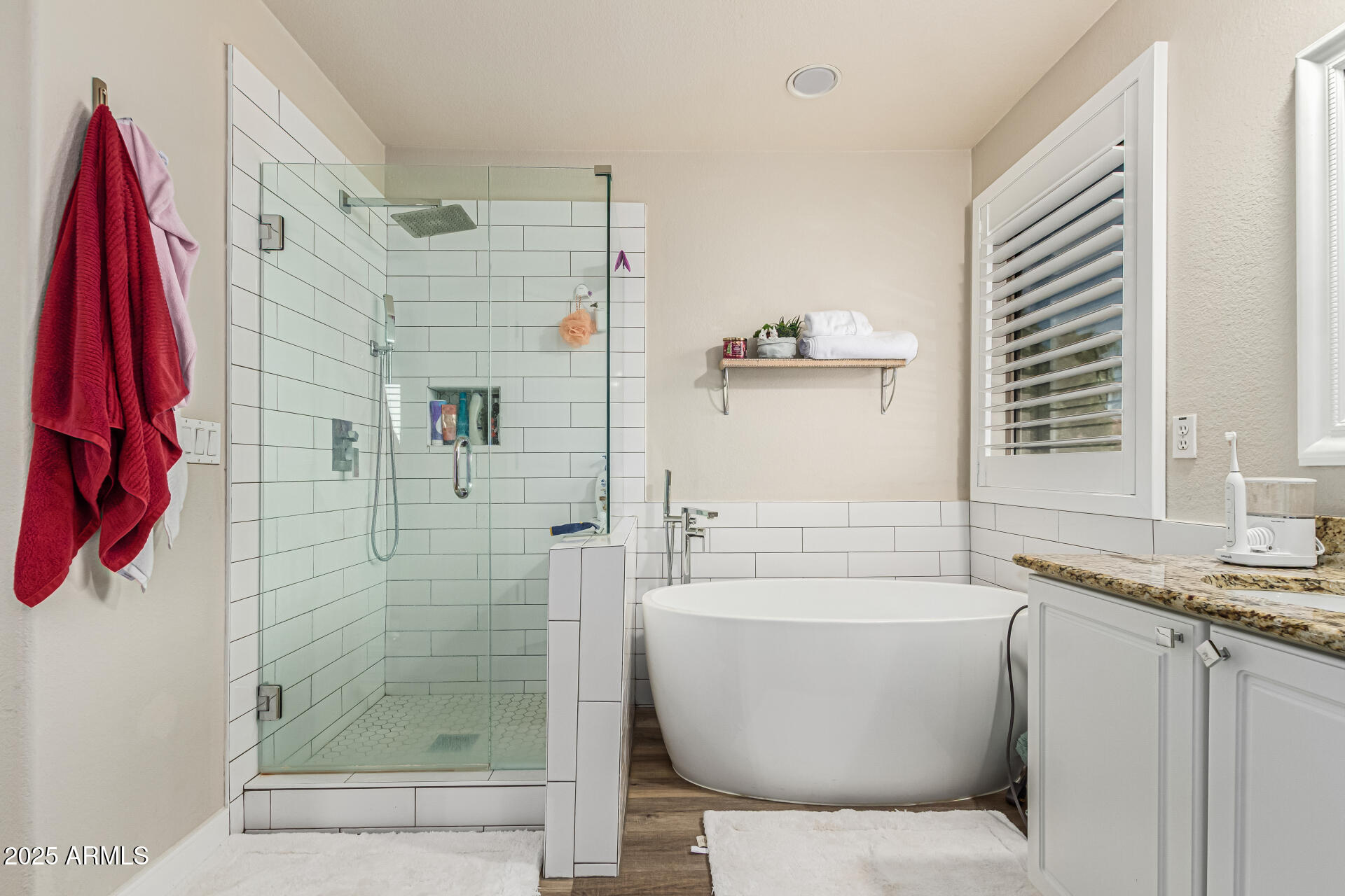 1038 East Harrison Court Gilbert, AZ 85295 - Photo 16 of 27 a bathroom with a bathtub and a shower