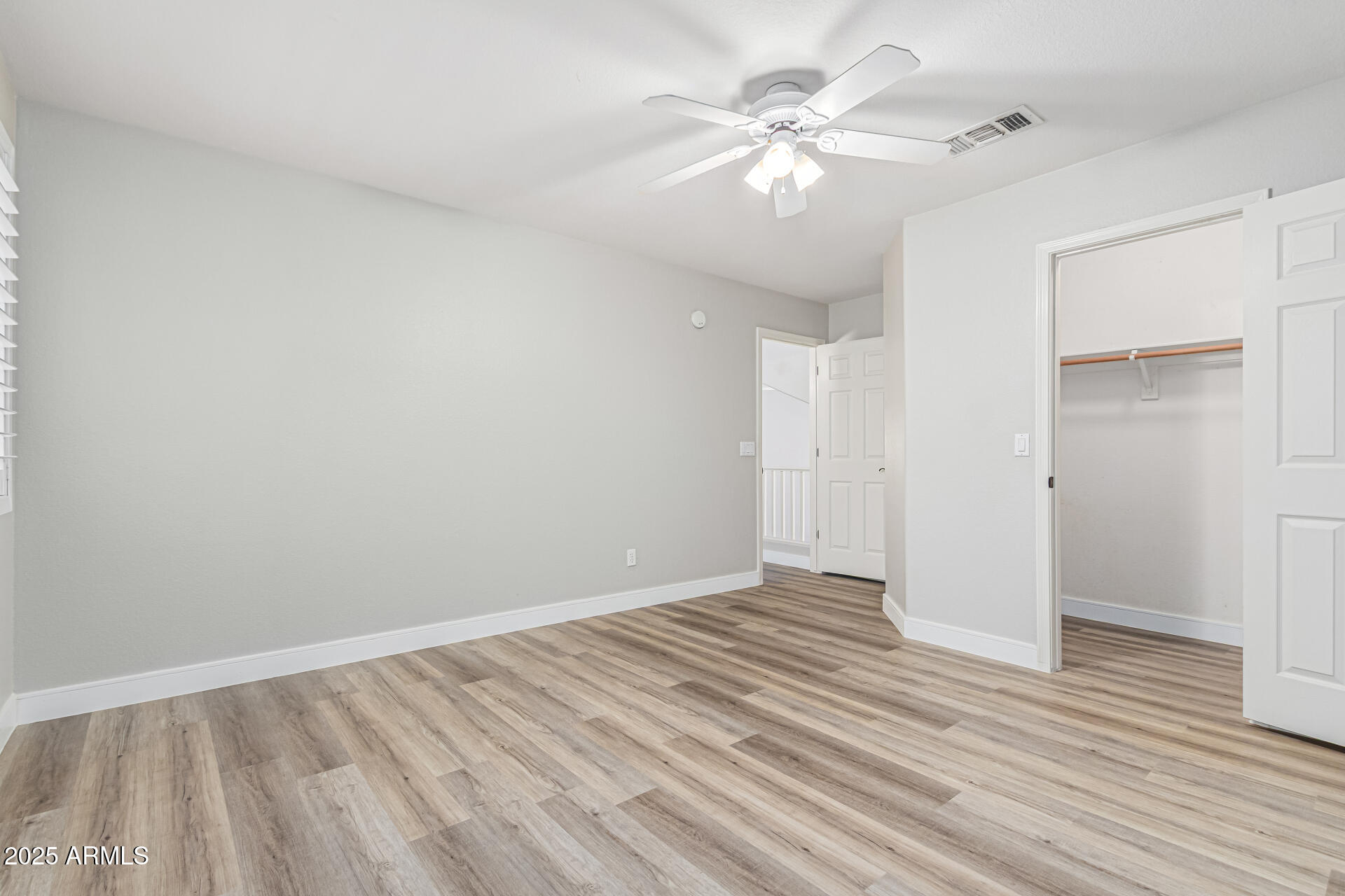1038 East Harrison Court Gilbert, AZ 85295 - Photo 19 of 27 a view of an empty room with wooden floor
