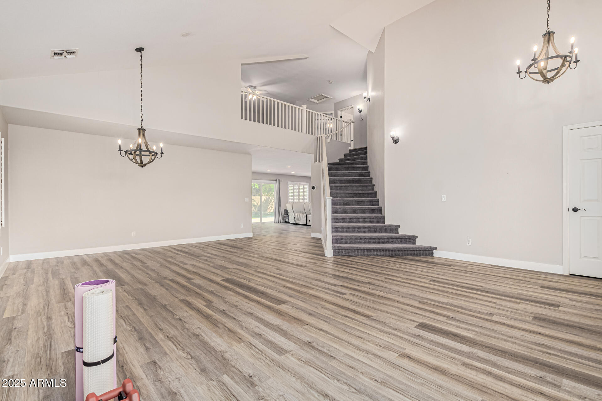 1038 East Harrison Court Gilbert, AZ 85295 - Photo 3 of 27 a view of a room with wooden floor and ceiling fan
