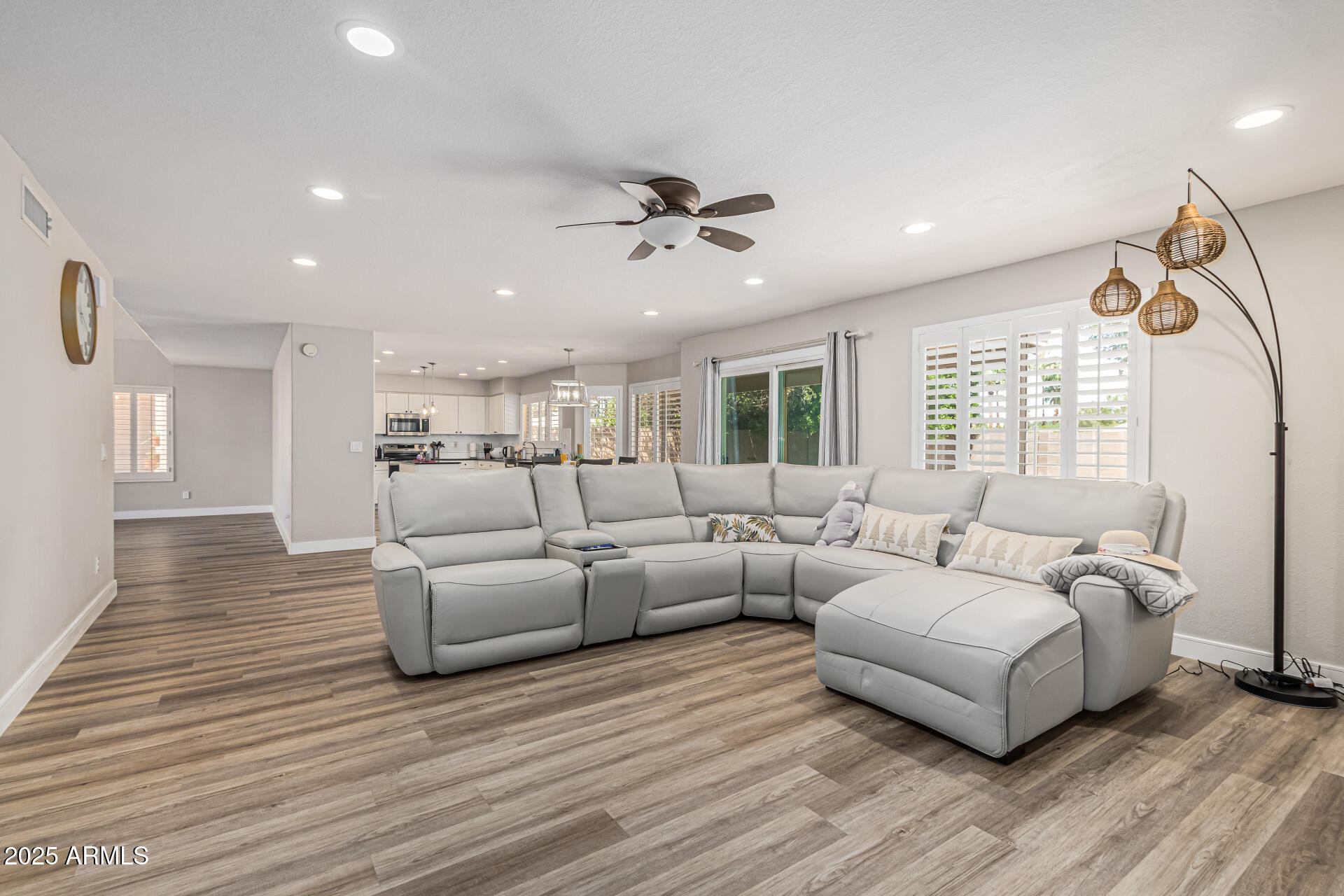 1038 East Harrison Court Gilbert, AZ 85295 - Photo 5 of 27 a living room with furniture and a large window