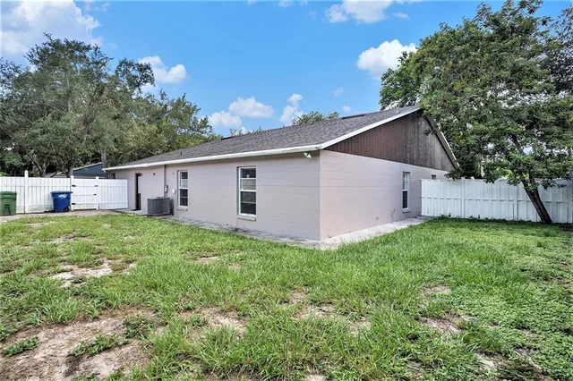 a view of a backyard with plants and a garden