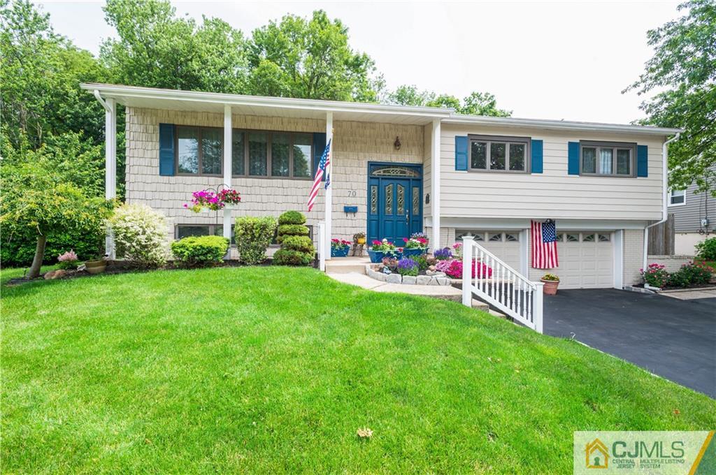 70 Wilk Road Edison, NJ 08837 - Photo 1 of 24 a view of an house with backyard space and garden