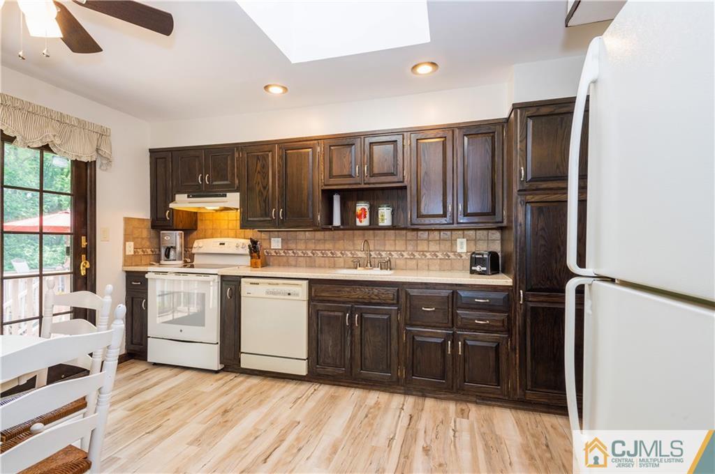 70 Wilk Road Edison, NJ 08837 - Photo 11 of 24 a kitchen with stainless steel appliances granite countertop a refrigerator and a stove top oven