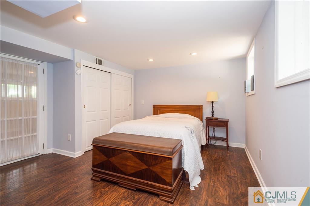 70 Wilk Road Edison, NJ 08837 - Photo 19 of 24 a bedroom with a bed and wooden floor