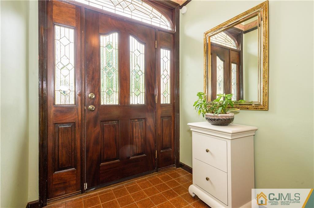 70 Wilk Road Edison, NJ 08837 - Photo 3 of 24 a bathroom with a sink a mirror and a shower