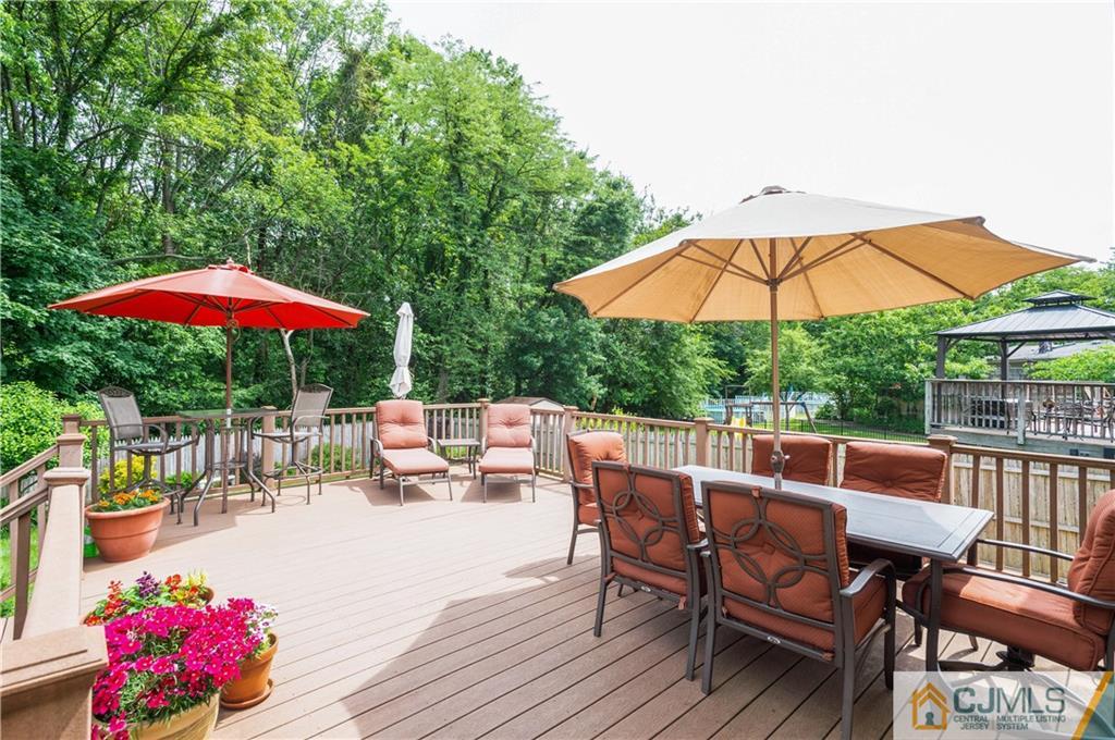70 Wilk Road Edison, NJ 08837 - Photo 21 of 24 a view of backyard with seating space and wooden floor