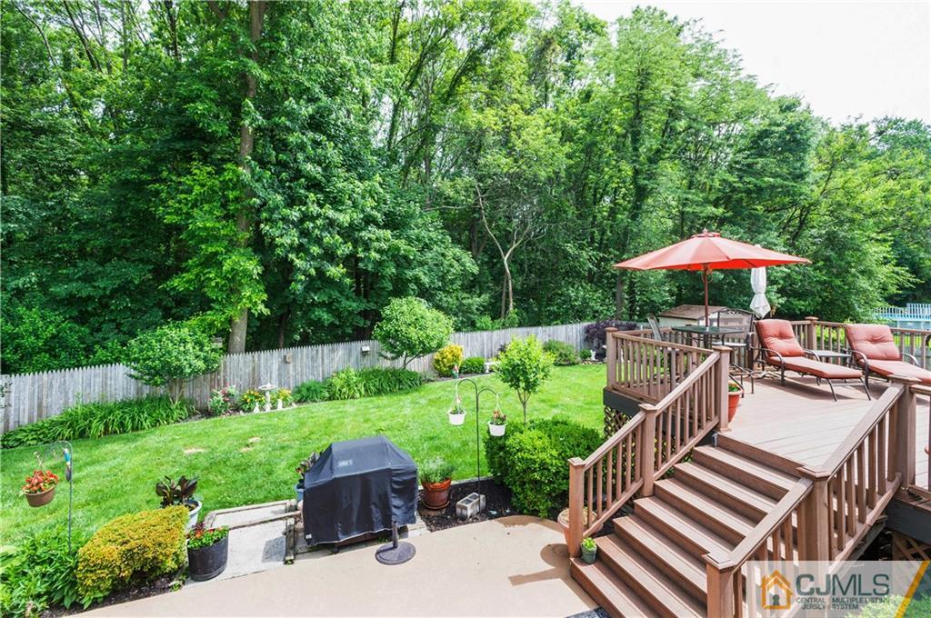 70 Wilk Road Edison, NJ 08837 - Photo 22 of 24 a view of a table and chairs under an umbrella