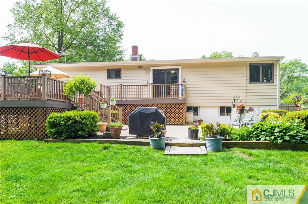 70 Wilk Road Edison, NJ 08837 - Photo 24 of 24 a view of a house with backyard sitting area and garden