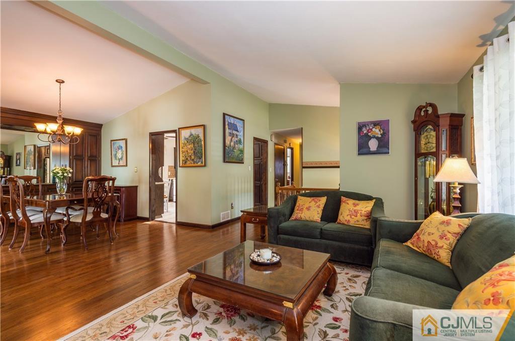 70 Wilk Road Edison, NJ 08837 - Photo 7 of 24 a living room with furniture and wooden floor