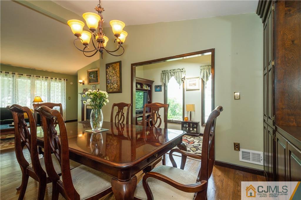70 Wilk Road Edison, NJ 08837 - Photo 9 of 24 a view of a dining room with furniture and chandelier