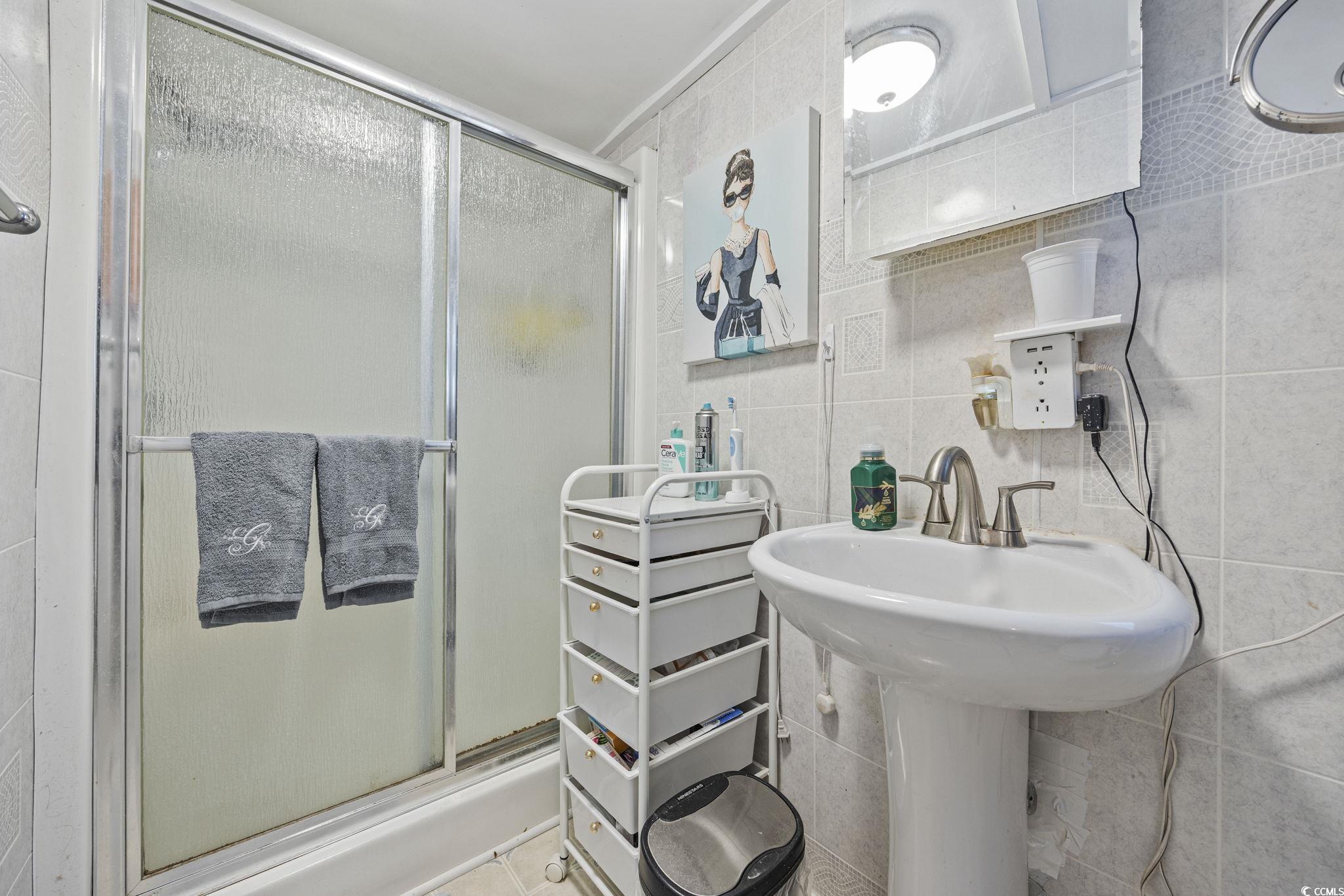 80 Princess Drive North Myrtle Beach, SC 29582 - Photo 15 of 27 Full bathroom with tile walls and a shower stall