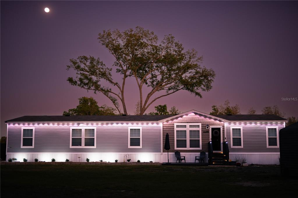 a front view of a house with yard
