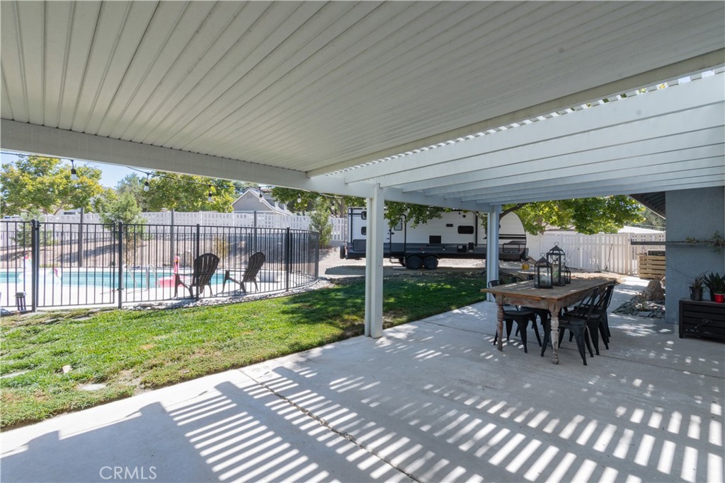 1766 Union Road Paso Robles, CA 93446 - Photo 16 of 31 a view of a patio with table and chairs potted plants with a garden