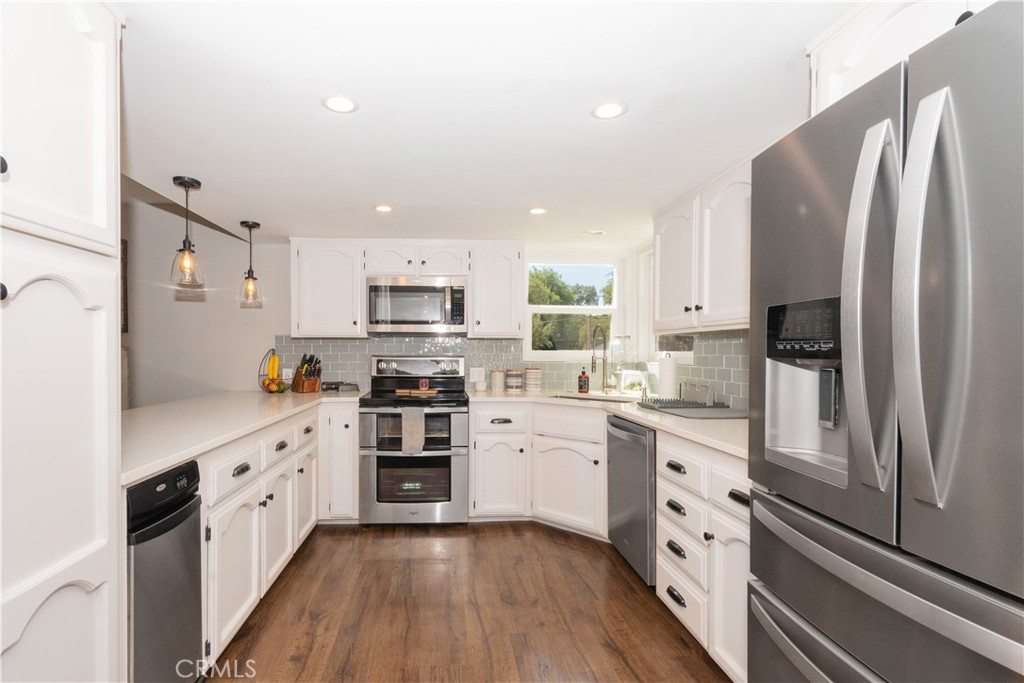 1766 Union Road Paso Robles, CA 93446 - Photo 7 of 31 a kitchen with stainless steel appliances a sink cabinets and a refrigerator