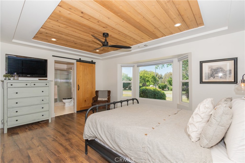 1766 Union Road Paso Robles, CA 93446 - Photo 8 of 31 a spacious bedroom with a bed and a flat screen tv