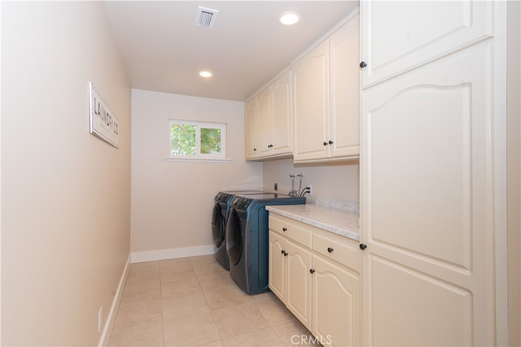 1766 Union Road Paso Robles, CA 93446 - Photo 10 of 31 a kitchen with white cabinets and sink