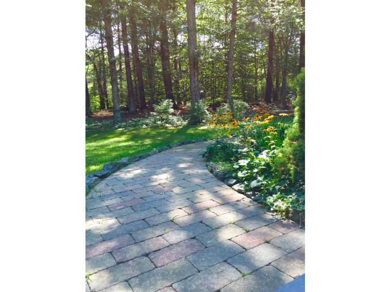 11 Azalea Avenue Exeter, RI 02822 - Photo 3 of 25 Exterior Front. Beautiful paved walkway highlights gardens and landscaping.