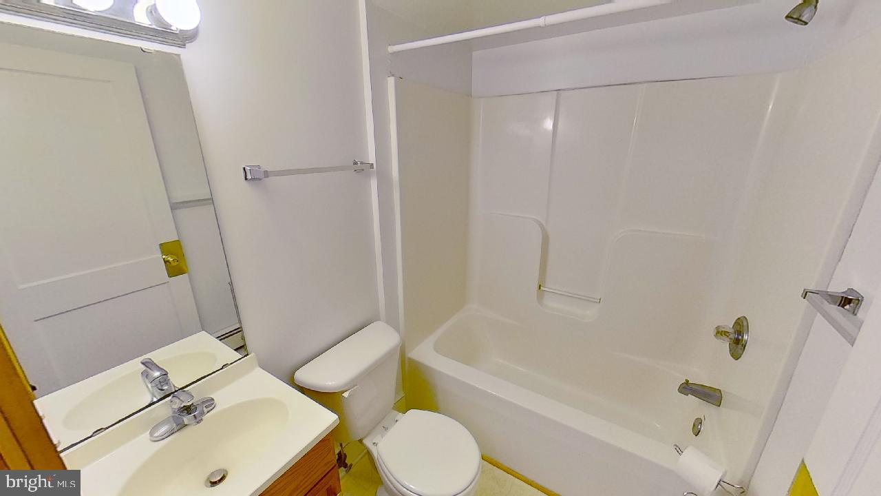 42464 Fairgrounds Road Leonardtown, MD 20650 - Photo 15 of 33 a bathroom with a sink and a tub