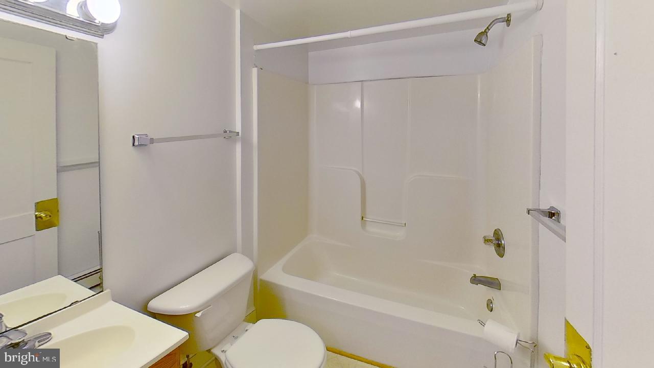 42464 Fairgrounds Road Leonardtown, MD 20650 - Photo 26 of 33 a bathroom with a sink toilet and bathtub