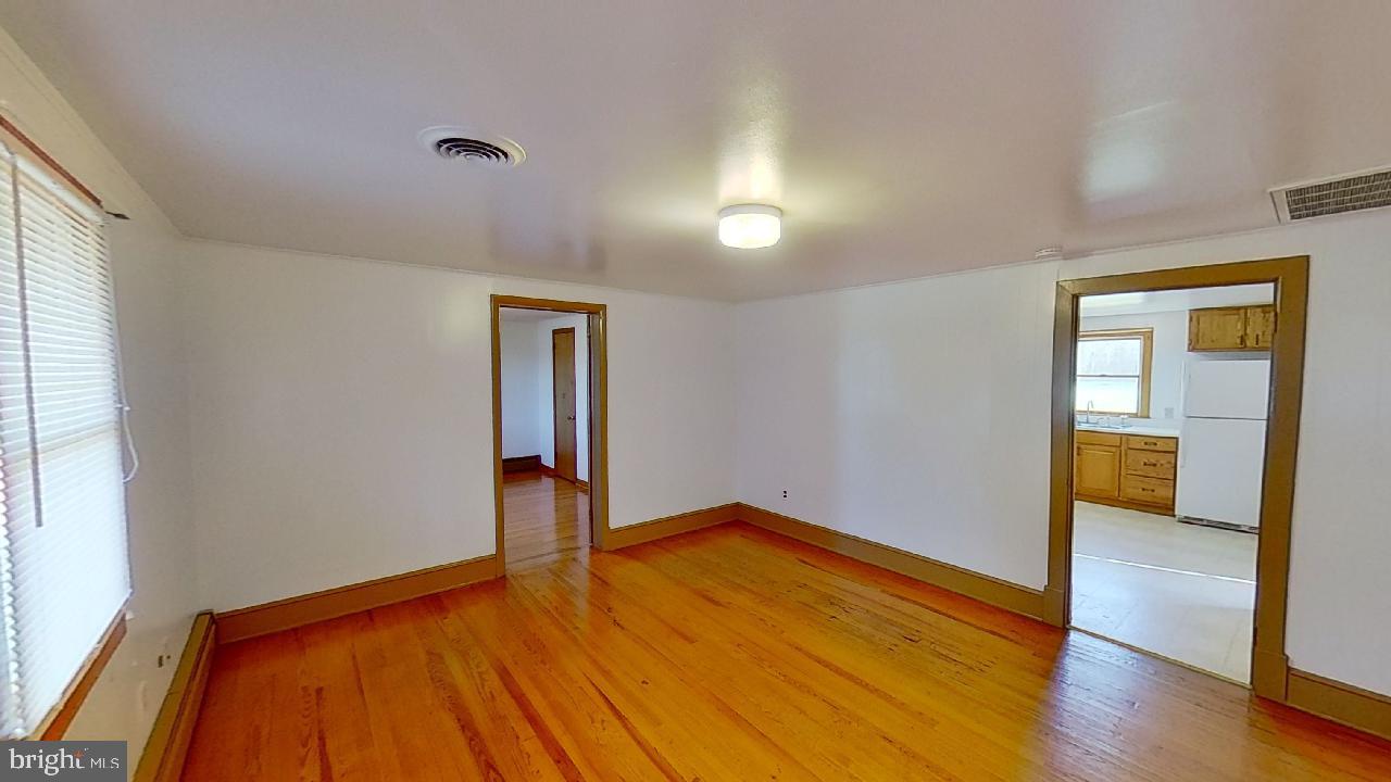 42464 Fairgrounds Road Leonardtown, MD 20650 - Photo 6 of 33 a view of empty room with wooden floor