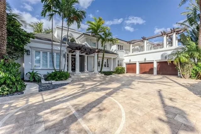 a dining room with furniture and a window