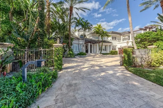 a dining room with furniture a rug and a large window