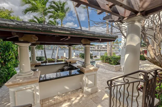 a bedroom with furniture and large windows