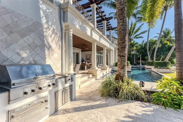 a living room with furniture a rug and a large window