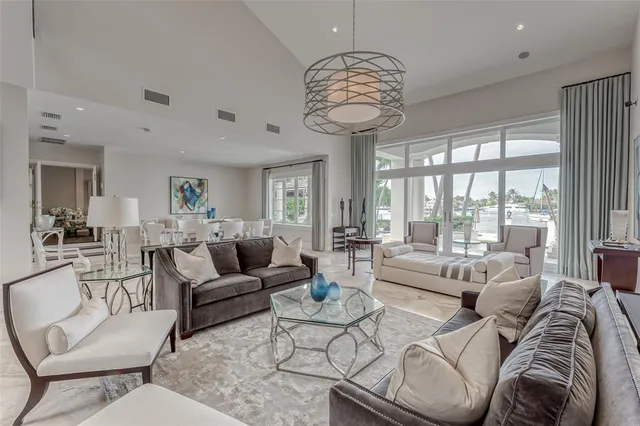 a dining room with furniture wooden floor a chandelier