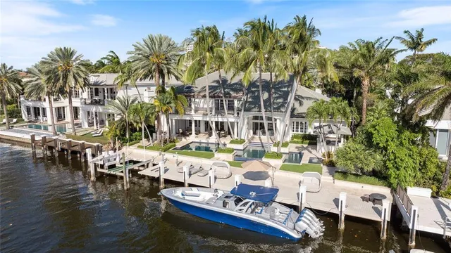 an aerial view of a house with a lake view