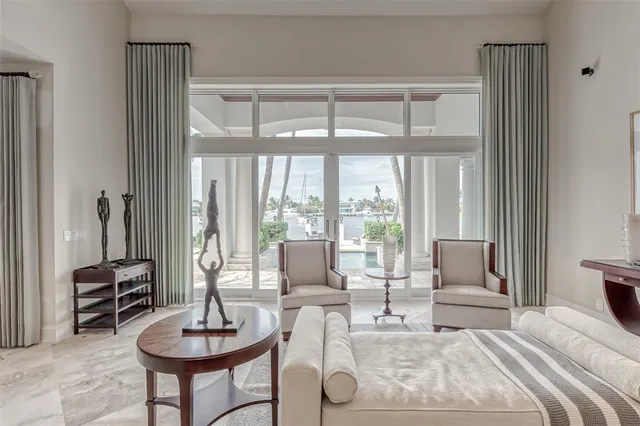 a dining room with furniture a livingroom and chandelier