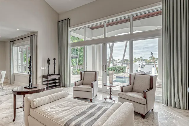 a bedroom with a large bed and a dresser