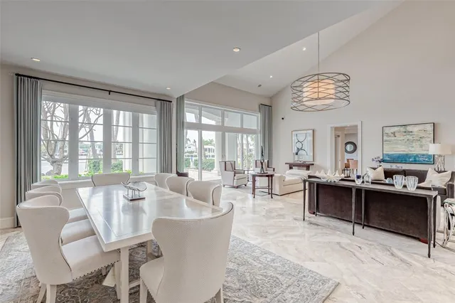 a bedroom with a bed and dresser with mirror