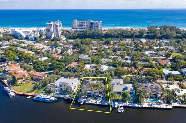 a view of a patio with table and chairs potted plants with wooden floor