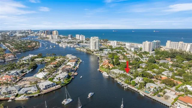 a dining room with furniture a rug and a large window
