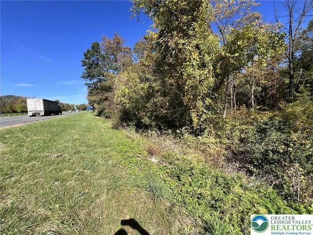 a view of a swimming pool with a yard